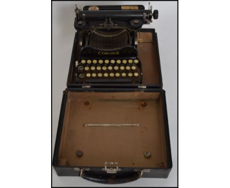 An unusual 20th century industrial vintage Corona reporters folding small typewriter retailed by James Moore / Belfast patent
