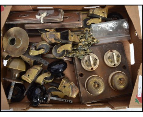 A mixed lot of architectural fittings, industrial brass switches, door knobs, handles and castors etc ( please see illustrati