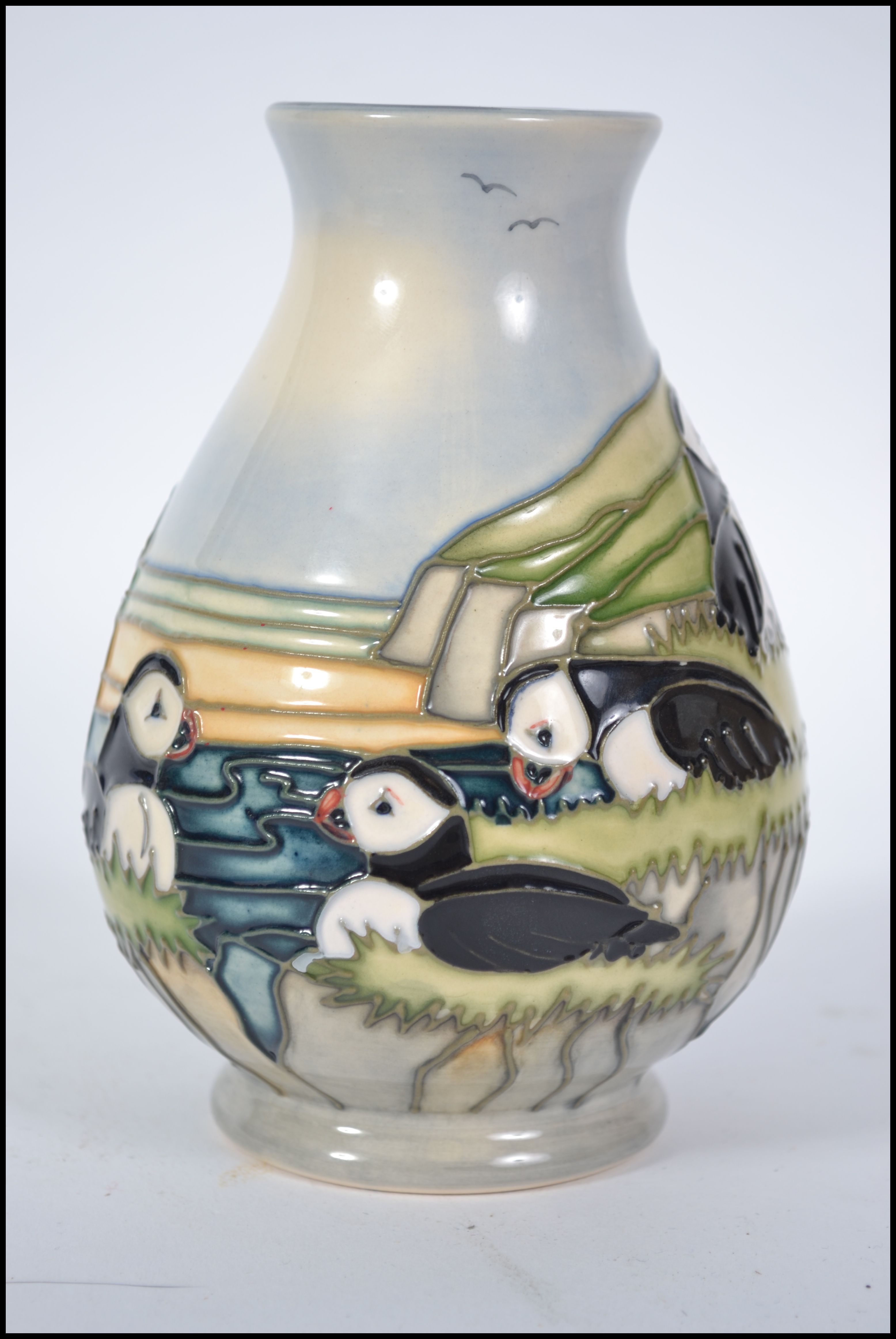 A Moorcroft Pottery Puffin pattern baluster vase decorated with puffins