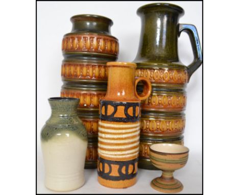 A collection of various West German fat lava ceramic vases and stick stands of various sizes.