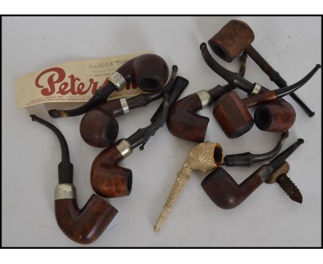 A good collection of vintage 20th century pipes. Consisting mainly of pipes by K & P Peterson, to include silver hallmarked c