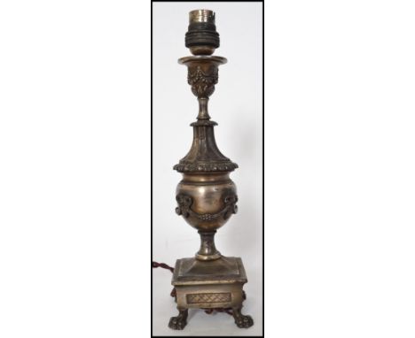 A vintage 20th century Ediswan Rococo style table lamp raised on pad feet under a square base Measures 30cms high.