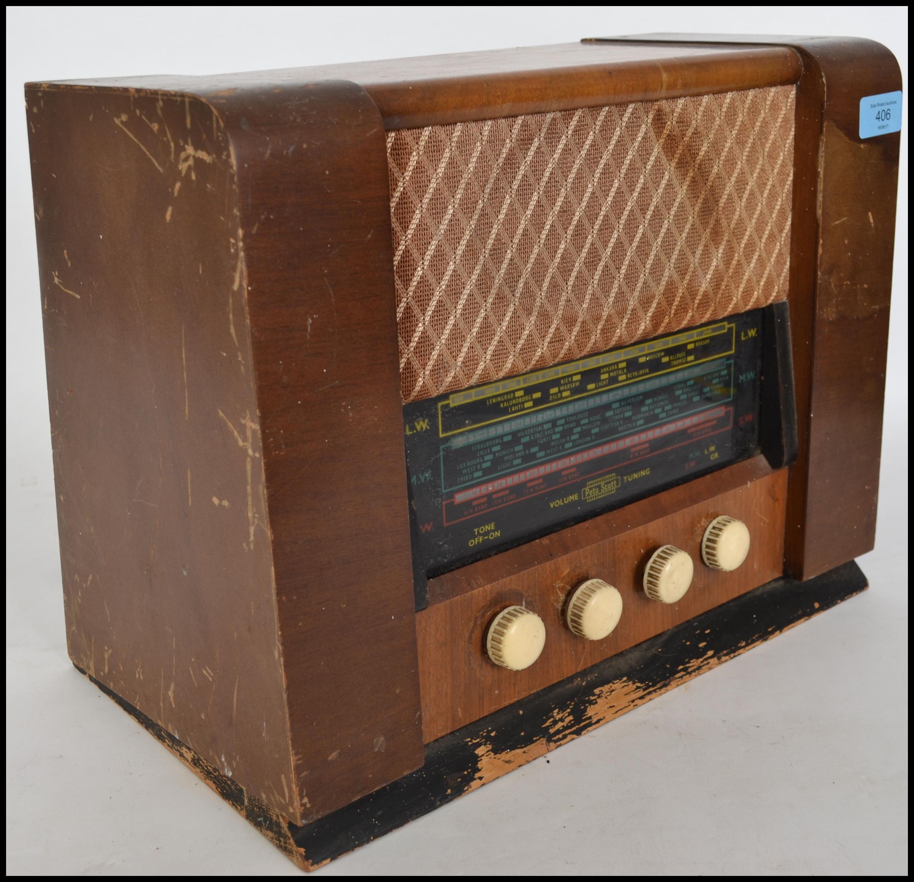 A vintage 20th century 1940's wooden cased valve radio. The glass dial ...