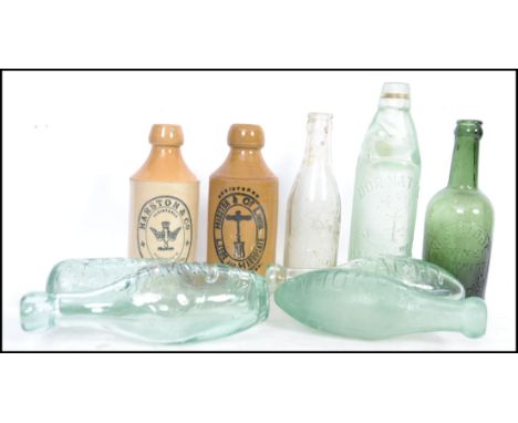 A group of 9 vintage ginger beer and codd bottles including Bawden of Ilfracombe, Yacht of Exeter, Mumby o Portsmouth, Ridge,