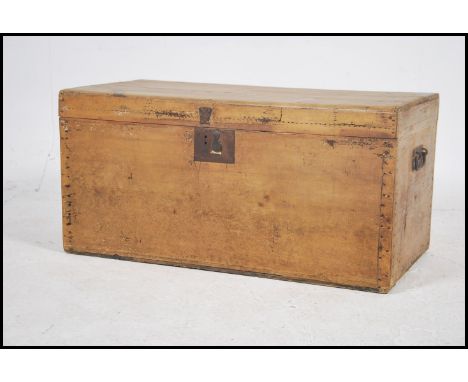 A vintage 20th century pine chest / storage trunk having lock to front with hinged top revealing a spacious interior.