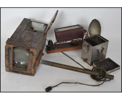 A collection of vintage photographic and developing equipment to include a Dallan development Tank, light bulbs, light boxes 