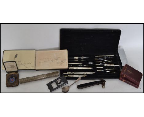 A dealers lot to include a good cased Maths set, rules, needlecase, Autograph book, 2 silver hallmarked medals, baseball, car