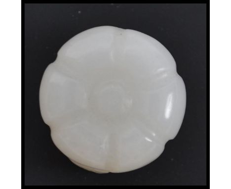 A believed Republic period white jade button, in the form of a flower.