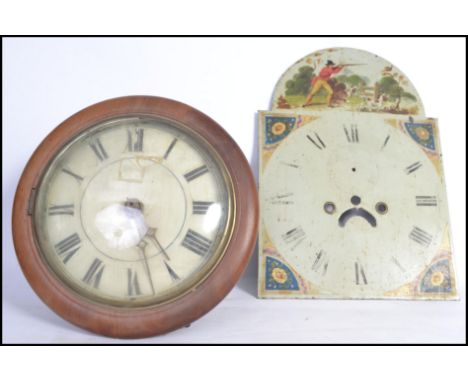 A vintage early 20th century postman's clock striking on a bell with a Roman numeral chapter ring and faceted hands along wit