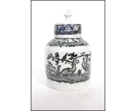 A late 18th century black transfer printed tea caddy probably Staffordshire, the base bearing label for the Rowland Williams 
