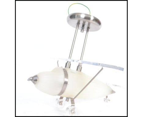 A retro style aeroplane ceiling lamp light having a frosted glass body with chrome metal detailing, moving propeller and acry
