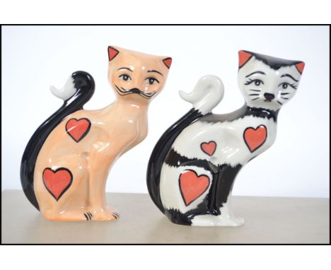 Two Lorna Bailey ceramic pottery cats Valentine 2002 41/50 and Valentine 2003 36/75 both with certificates. Measures 14cms hi