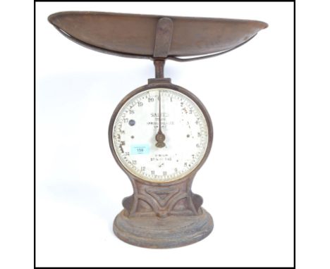 A vintage set of Salter Industrial trade scales being spring balanced no 50T complete with the tray. Measures 42cms high. 