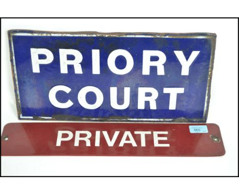 A retro 20th century enamel advertising / notice sign on burgandy with white notation ' Private ' together with an enamel blu