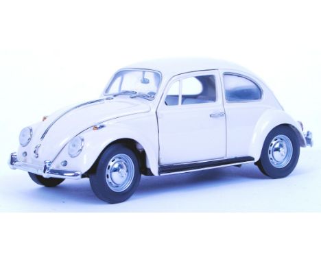 A Franklin Mint precision diecast model 1967 Volkswagen VW Beetle. 1:24 scale. With all inner packing, paperwork and box.  