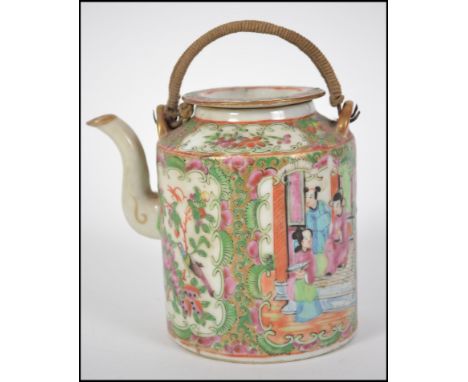 A 20th century Oriental teapot having a wicker handle atop depicting scenes of Geisha's in cartouche panels. Measures 12cms h