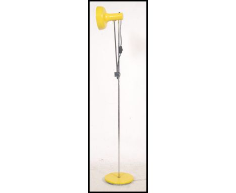 A 1980's retro Italian adjustable yellow and chrome floor standing spot light lamp with single pendant shade and terraced bas