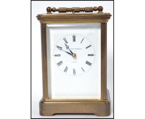 A good Matthew Norman brass cased carriage clock. The clock housed within a simple case with eight day striking movement with