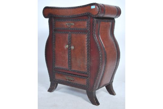 An Unusual Faux Leather Vinyl Studded Drawer Cabinet Unit Having A