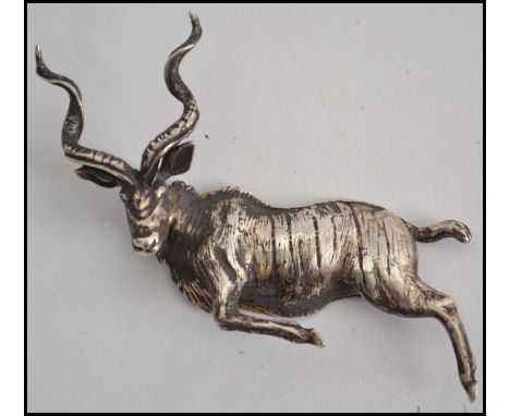 An unusual silver mounted stag figural piece having unusual flat back. The item believed mounted to a clock?