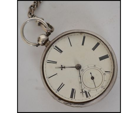 A silver hallmarked open faced pocket watch and silver hallmarked fob chain. The enamel face having a roman numeral chapter r