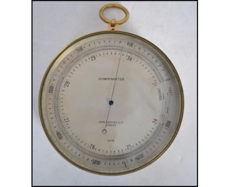 A vintage early 20th century bulk head barometer by John Wardale and Co of London dated 1918.