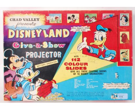 An original vintage Chad Valley Disneyland battery operated 'Give A Show' Projector with 112 colour slides. Contents unchecke