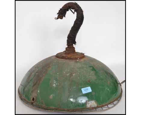 A mid century industrial green and white enamel painted pendant light having inset 6 bulb fitment to inside
