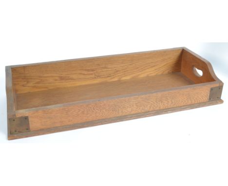 A Victorian oak library tray with bracket work joints and dovetailing having gallery sides with pierced handles. Measures 12c
