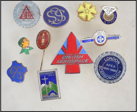 A small group of vintage pin badges to include a hallmarked silver The Girls Life Brigade long service badge, Workers Union b