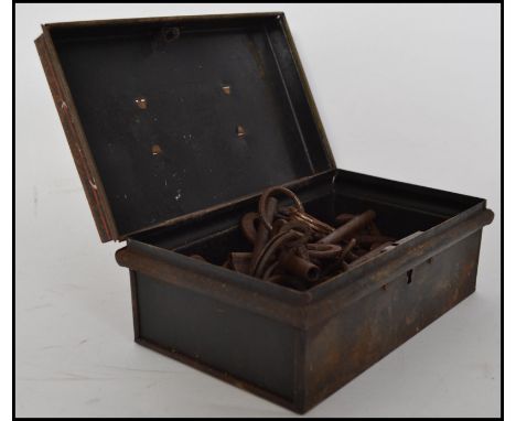 A collection of 19th century and 20th century furniture keys of various sizes. Stored within a vintage metal safe tin. Measur