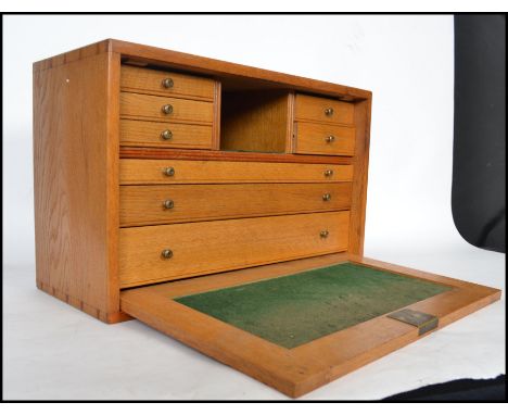 A well built light oak vintage engineers case having a full front cover opening to reveal a series of felt lined drawers to t