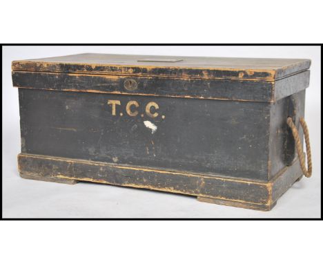 A VIctorian ebonised pine tool chest - steamer trunk having monogram front with hinged top having brass plaque for TC Charlwo