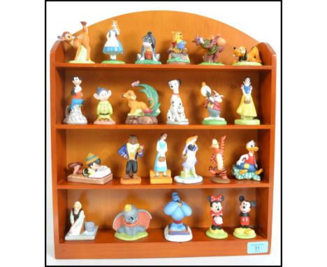 A collection of 23 Walt Disney ceramic characters to include Micky and Minnie, Bambi, Snow White, Dumbo, Tigger and Pooh toge
