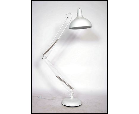 A large floorstanding anglepoise lamp in the manner of Herbert Terry in white having large UFO style pendant shade and terrac