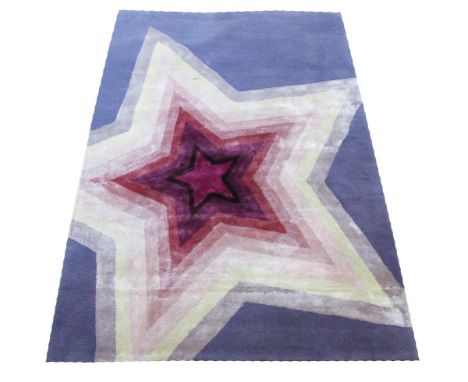 FINE BENNARES CARPET, 183cm x 122cm, of star design on purple field. 