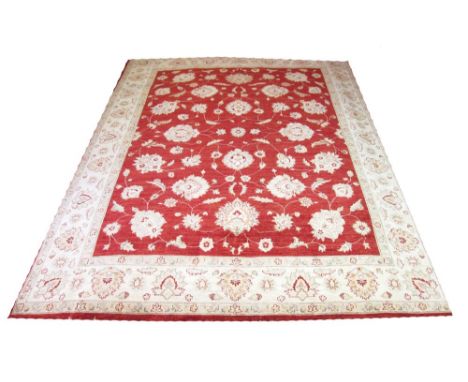 FINE QABUL CARPET, 351cm x 271cm, large palmette and vine design on russet field. 