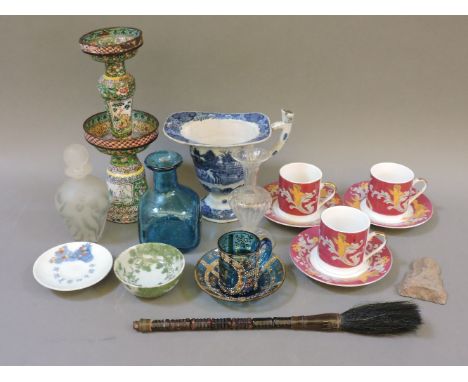 A collection of glass ware, including a scent bottle and stopper, an Islamic style cup and saucer, a blue bottle, clear vase,