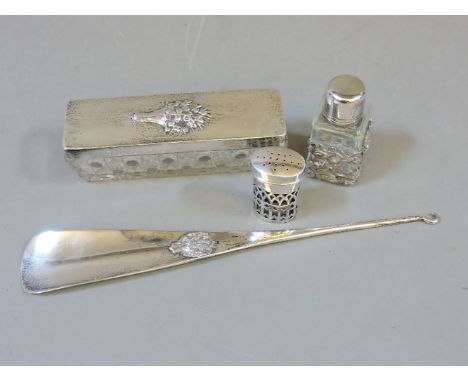 A silver lidded pin box, pepperette, a button hook, and scent bottle