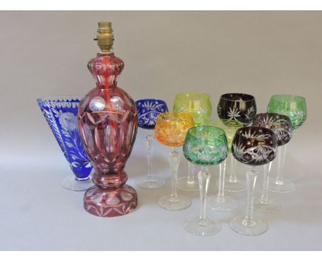 A collection of flash cut hock glasses, a vase, and a lamp base