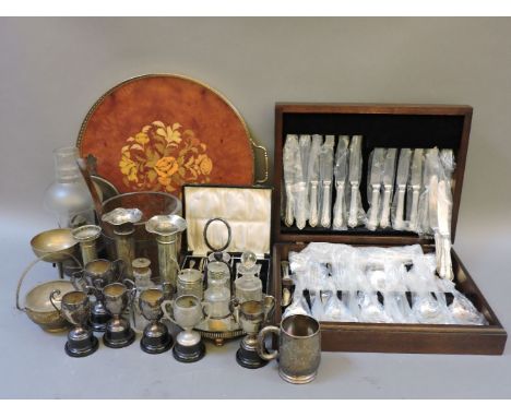 A quantity of plated and metal ware, to include a canteen of cutlery, a cast iron 'dog' nut cracker, and a model of a ship's 