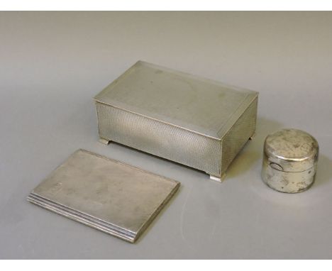 An engine turned silver cigarette box, by Mappin & Webb, Birmingham 1936, a silver cigarette case by Smith and Bartlam, Birmi