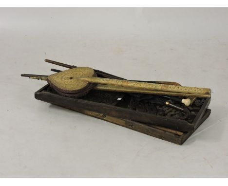 Three walking sticks, umbrella, Persian bellows, and print tray with blocks