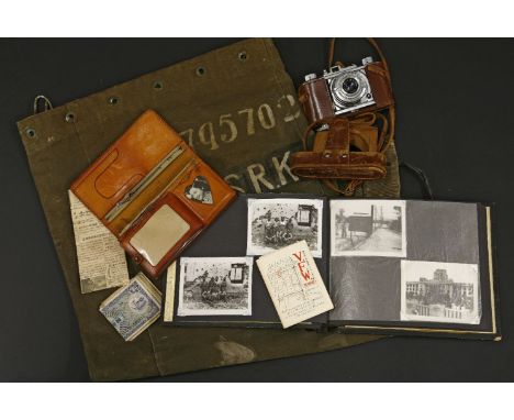 Items belonging to R K Jones, who fought in the Korean war, including kit bag, 'Pigeon' camera, photo album of Egypt, Japan, 