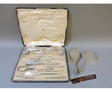 A silver backed gentleman's set, engine turned decoration in box, part missing, and a silver backed hairbrush, comb and mirro