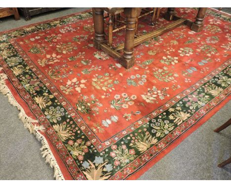 A burgundy ground carpet, in the Persian style, 260 x 350cm