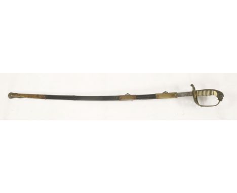 A German Imperial Navy sword, the brass hilt decorated and pierced with lion's head pommel, red eyes, folding langet decorate