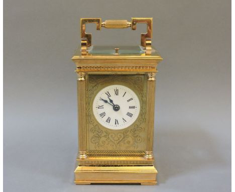 A modern brass carriage clock, by Charles Frodsham, London, with white enamel dial