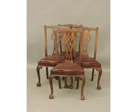 Four early 20th century Chippendale style dining chairs, with drop in seats, carved knees, and ball and claw front supports