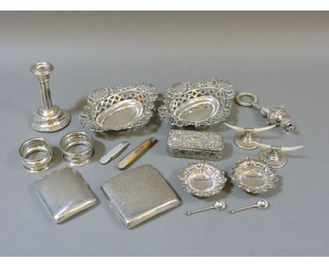 A collection of silver, a pair of pierced dishes, a pair of salts, two cigarette cases, two mother of pearl knives, a pair of